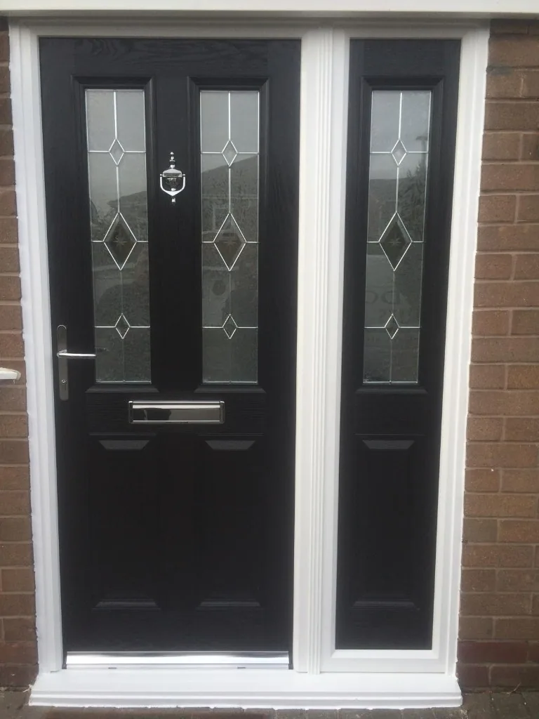 Black composite front door with matching side panel