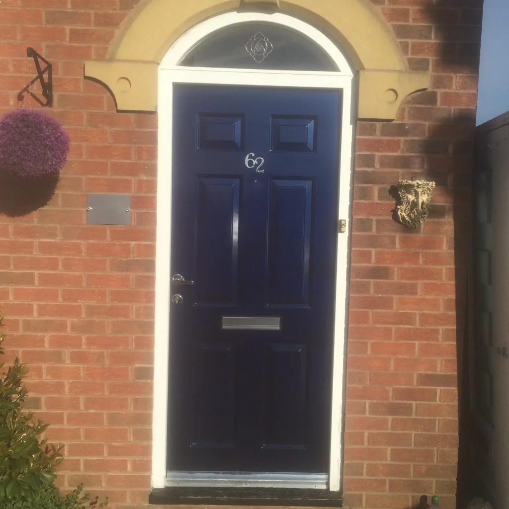 Navy blue composite front door with arched fanlight
