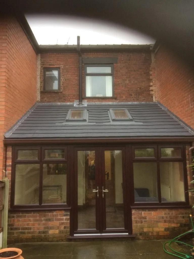 Rosewood uPVC conservatory with French doors and skylights
