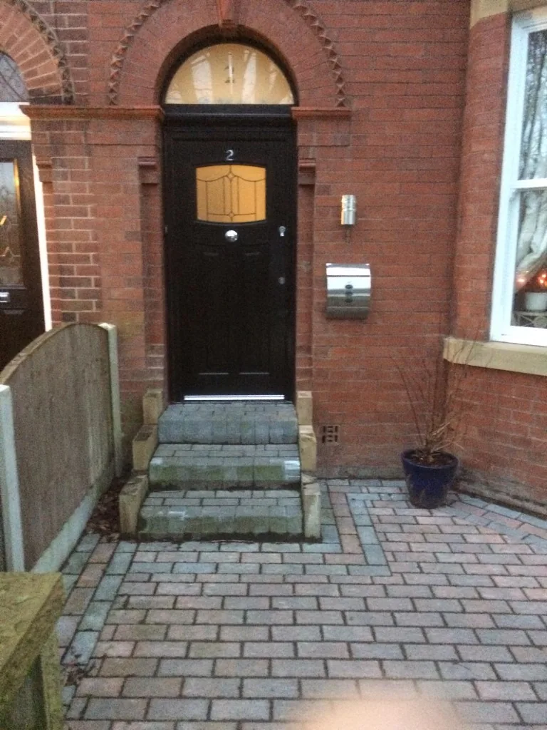 Black composite front door with arched fanlight