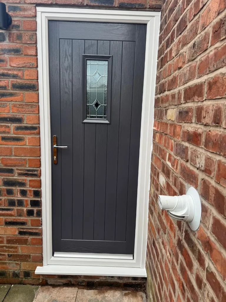 Anthracite grey composite cottage door with decorative glazing