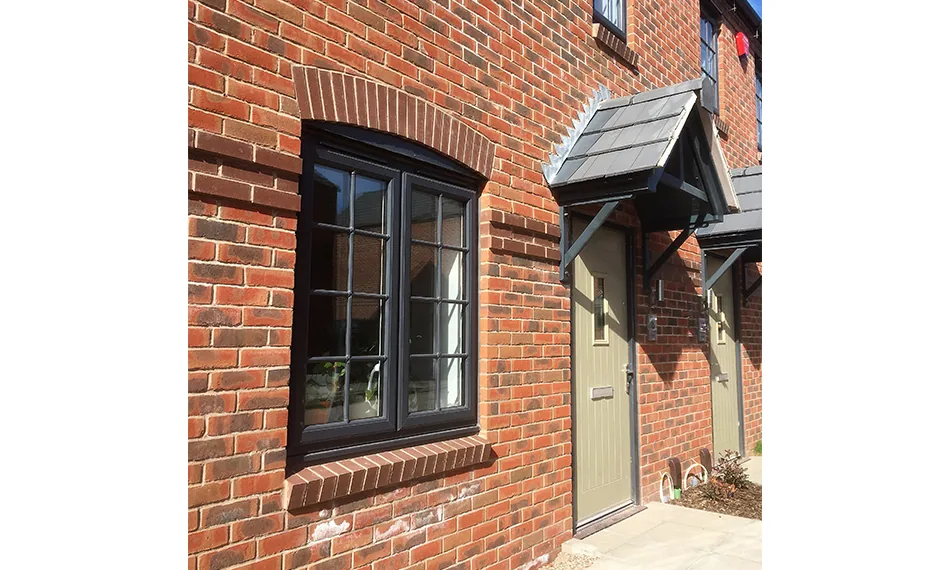 Slim anthracite grey aluminium windows on a modern Warrington home